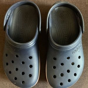 Crocs, women’s size 7 or men’s size 5, not worn